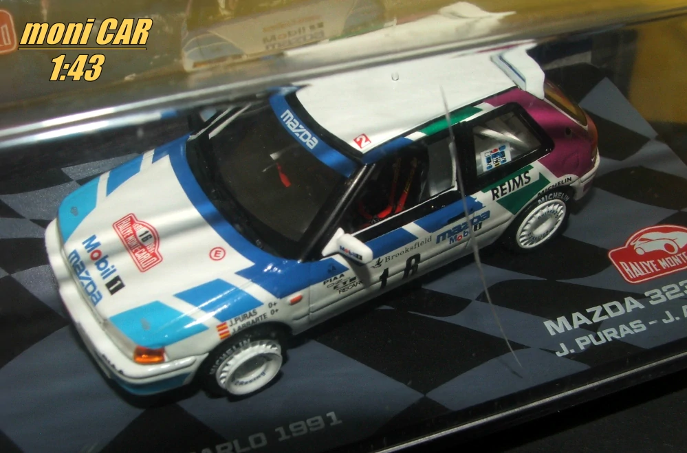 MAZDA 323 GTX 1989 No.16 - J. Puras - J. Arrarte - Rallye Monte Carlo 1991(1:43) Altaya/IXO